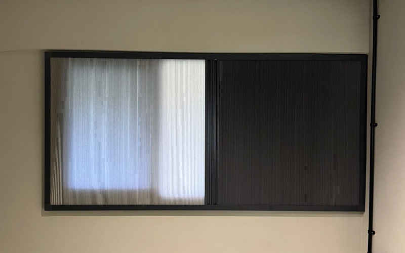 Light-filtering and blackout pleated window blinds.
