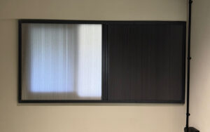 Blackout honeycomb blinds for enhanced privacy and employee focus.