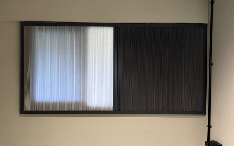 Blackout honeycomb blinds for enhanced privacy and employee focus.