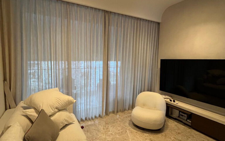 Floor-to-ceiling sheer curtains for HDB flat living room windows.