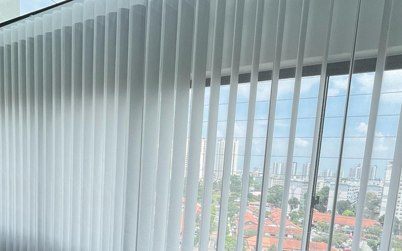 White vertical ripple fold curtains for modern home window decor.