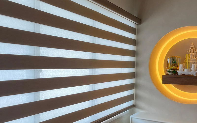 Smart zebra blinds providing light control in a living space.